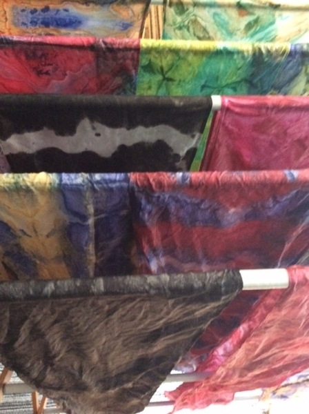 hand dyed shibori folded silk scarves washed and drying on Pender Island